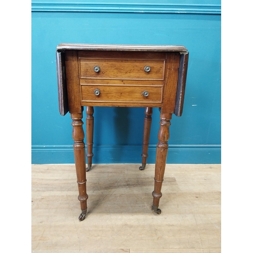 128 - 19th C. mahogany drop leaf lamp table with two drawers in the frieze raised on turned legs and brass... 