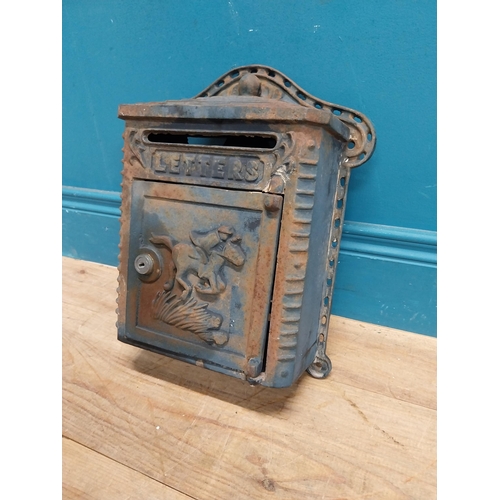 132 - Cast iron wall post box. { 36cm H X 39cm W X 14cm D }.