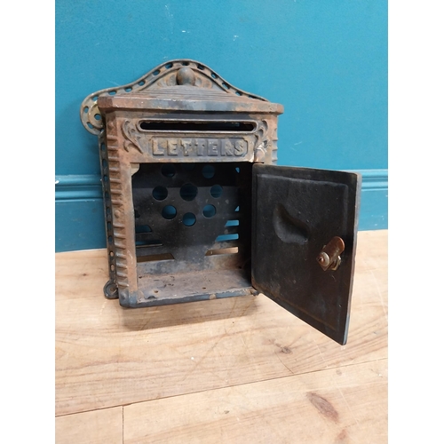 132 - Cast iron wall post box. { 36cm H X 39cm W X 14cm D }.