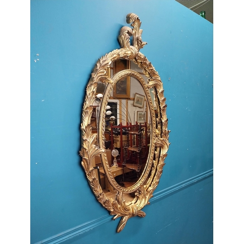 133 - Good quality gilt wall mirror in the Rococco style. {132 cm W x 70 cm W}.