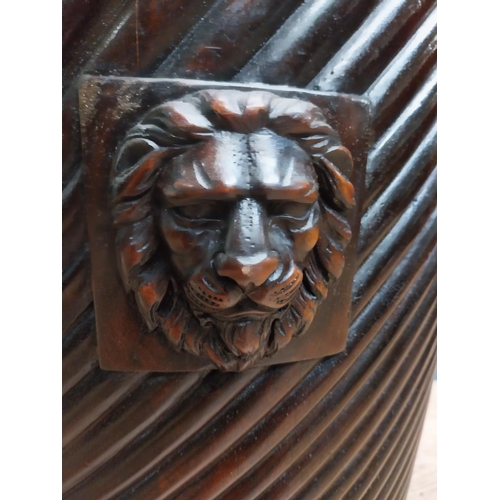 138 - Exceptional quality Irish mahogany brass bound spiral peat bucket decorated with lion's mask with or... 