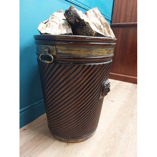 138 - Exceptional quality Irish mahogany brass bound spiral peat bucket decorated with lion's mask with or... 