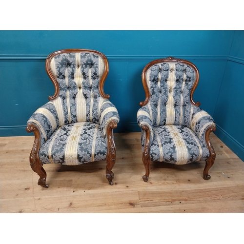 140 - Two Victorian mahogany and upholstered ladies and gents arm chairs raised on cabrioe legs {100 cm H ... 