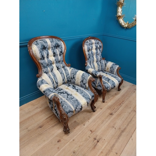 140 - Two Victorian mahogany and upholstered ladies and gents arm chairs raised on cabrioe legs {100 cm H ... 