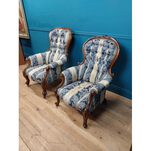 140 - Two Victorian mahogany and upholstered ladies and gents arm chairs raised on cabrioe legs {100 cm H ... 