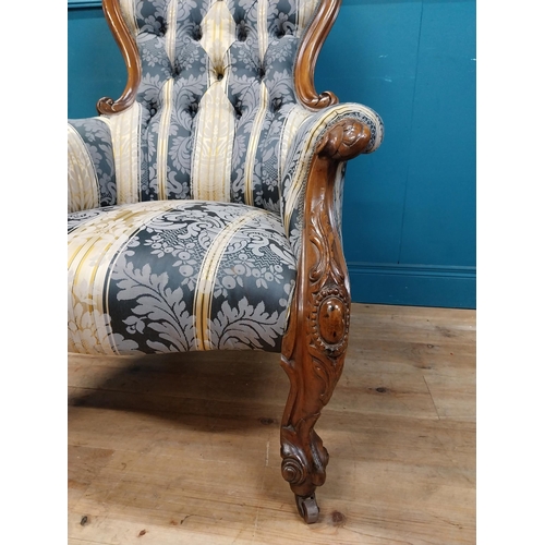 140 - Two Victorian mahogany and upholstered ladies and gents arm chairs raised on cabrioe legs {100 cm H ... 