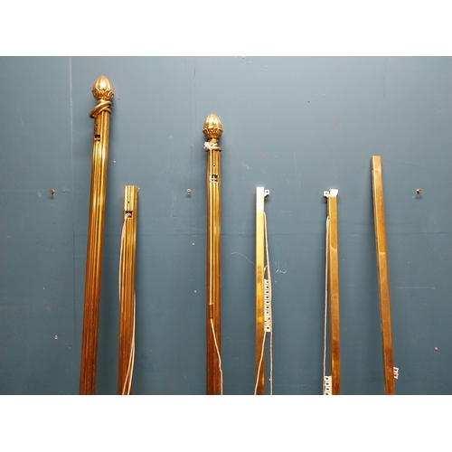 151 - Pair of good quality brass curtain poles. {220 cm L}