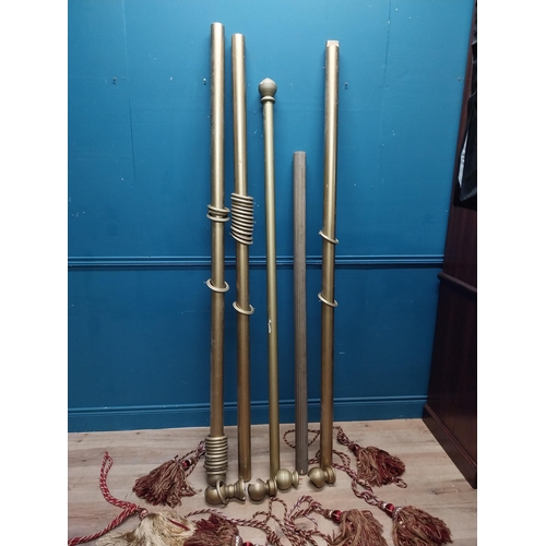 152 - Five gilded wooden curtain poles with ties. {114 cm L}, {209 cm L}. {190 cm L} and {210 cm L}