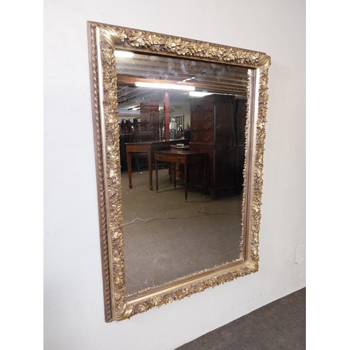 161 - Decorative gilt wall mirror {113 cm H x 83 cm W x 8 cm D}.