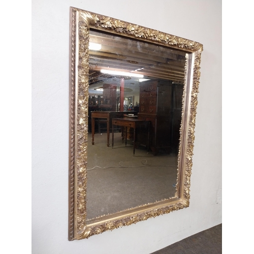 161 - Decorative gilt wall mirror {113 cm H x 83 cm W x 8 cm D}.