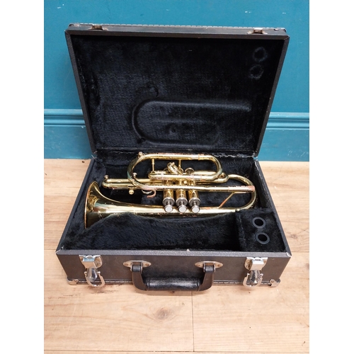 177 - Cased brass trumpet.