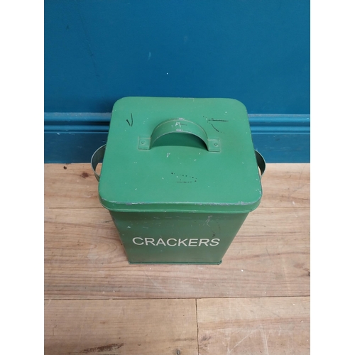 179 - Green painted metal Crackers lidded tin. {30 cm H x 24 cm W x 18 cm D}.