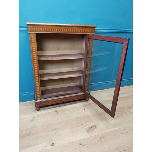 181 - Edwardian rosewood and satinwood inlaid side cabinet with single glazed door raised on bun feet {104... 