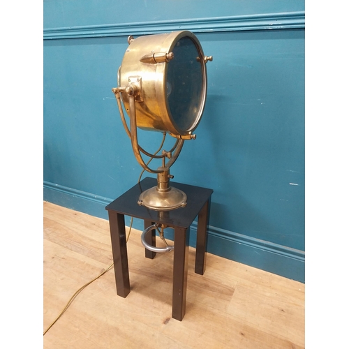 19 - Brass Francis spot light raised on painted pine table {96 cm H x 31 cm W x 31 cm D}.