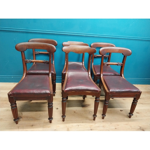 197 - Set of six 19th C. mahogany dining chairs with vinyl upholstered seats raised on reeded legs {86 cm ... 