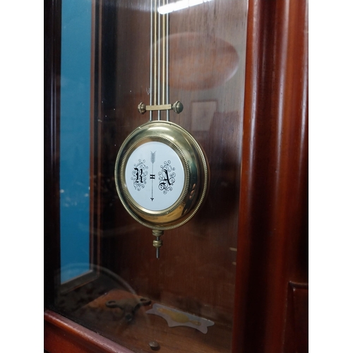 208 - Mahogany Vienna wall clock in the Victorian style with metal and ceramic pendulum. {128 cm H x 41 cm... 