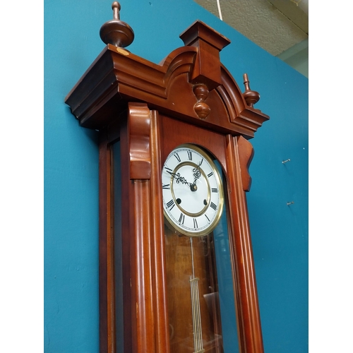 208 - Mahogany Vienna wall clock in the Victorian style with metal and ceramic pendulum. {128 cm H x 41 cm... 