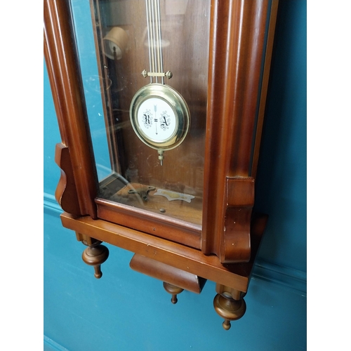 208 - Mahogany Vienna wall clock in the Victorian style with metal and ceramic pendulum. {128 cm H x 41 cm... 