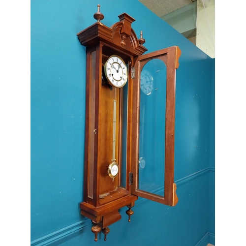 208 - Mahogany Vienna wall clock in the Victorian style with metal and ceramic pendulum. {128 cm H x 41 cm... 