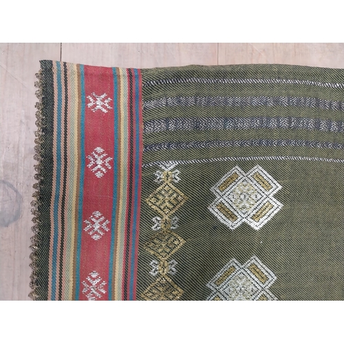 209 - Two decorative woven tribal skirts { 136cm L X 80cm W & 130cm L X 86cm W }.