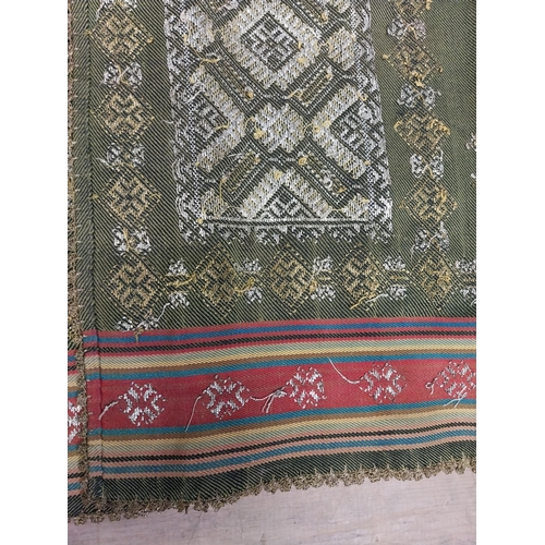 209 - Two decorative woven tribal skirts { 136cm L X 80cm W & 130cm L X 86cm W }.