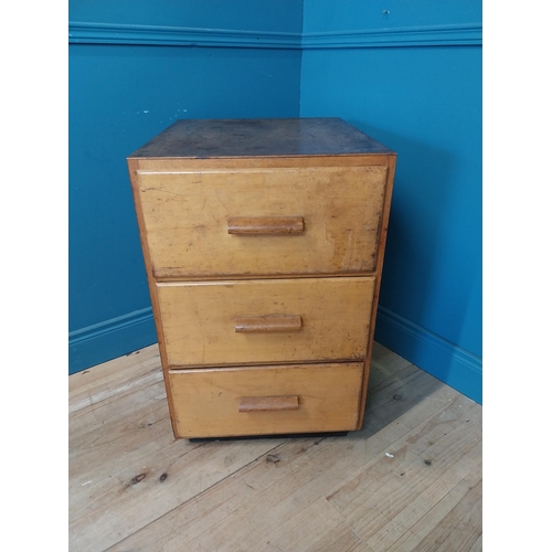 210 - 1950s maple office cabinet with three drawers {78 cm H x 50 cm W x 64 cm D}.