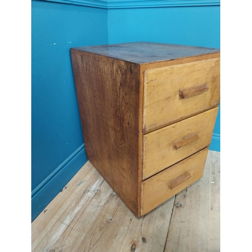 210 - 1950s maple office cabinet with three drawers {78 cm H x 50 cm W x 64 cm D}.