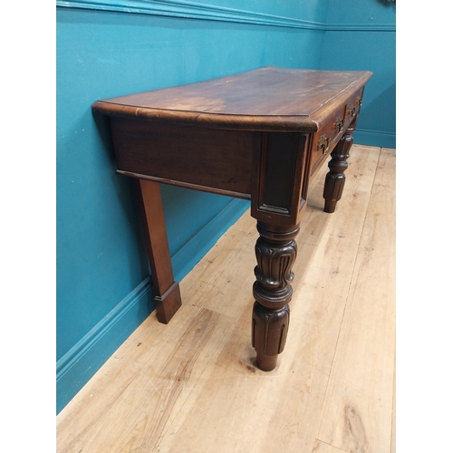 218 - William IV mahogany side table with two drawers in the frieze raised on carved legs {76 cm H x 138 c... 