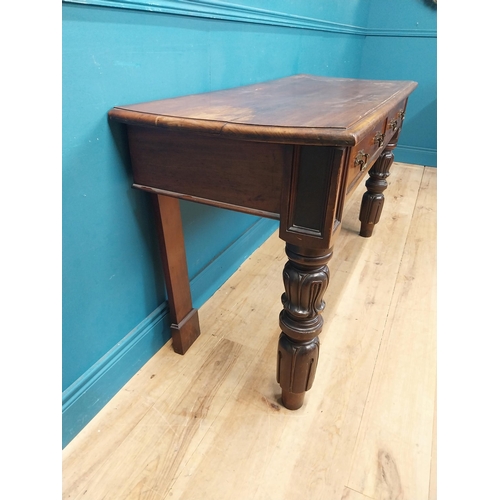 218 - William IV mahogany side table with two drawers in the frieze raised on carved legs {76 cm H x 138 c... 