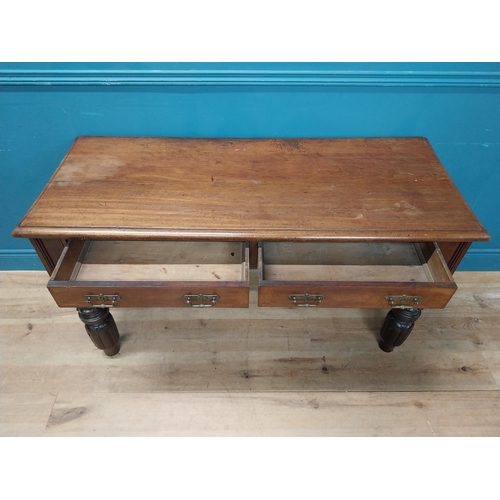 218 - William IV mahogany side table with two drawers in the frieze raised on carved legs {76 cm H x 138 c... 