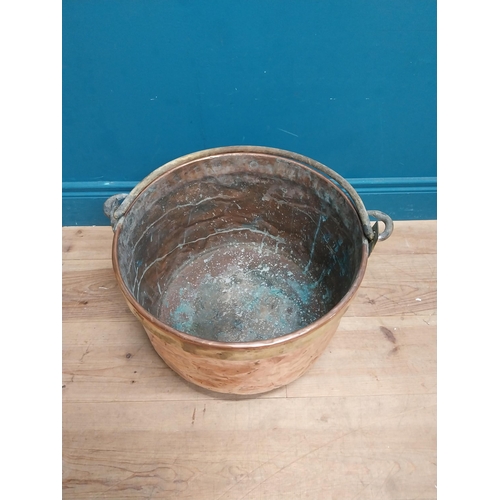 232 - 19th C. copper and brass log bucket with wrought iron handle {53 cm H x 45 cm Dia.}.