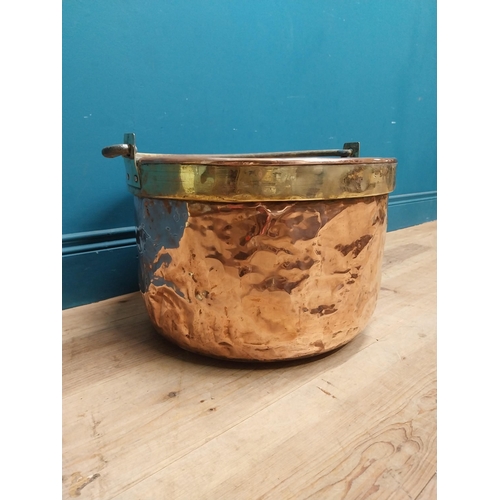 232 - 19th C. copper and brass log bucket with wrought iron handle {53 cm H x 45 cm Dia.}.