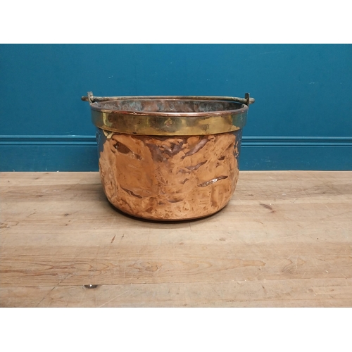 232 - 19th C. copper and brass log bucket with wrought iron handle {53 cm H x 45 cm Dia.}.