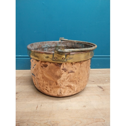 232 - 19th C. copper and brass log bucket with wrought iron handle {53 cm H x 45 cm Dia.}.