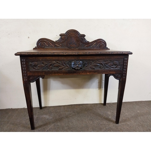 235 - 19th C. oak side table with carved gallery back with carved single drawer in the frieze raised on sq... 