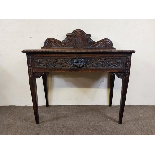 235 - 19th C. oak side table with carved gallery back with carved single drawer in the frieze raised on sq... 