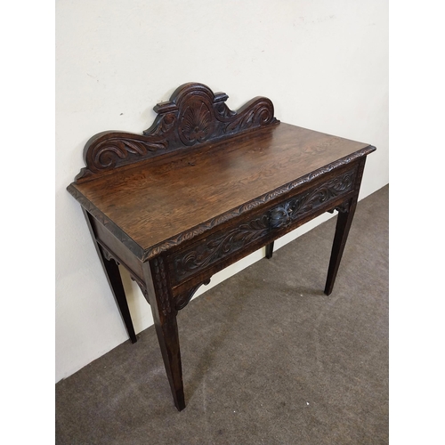 235 - 19th C. oak side table with carved gallery back with carved single drawer in the frieze raised on sq... 