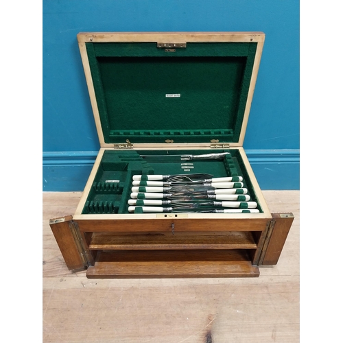 243 - Edwardian oak cased canteen of cutlery {22 cm H x 40 cm W x 29  cm D}.