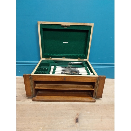 243 - Edwardian oak cased canteen of cutlery {22 cm H x 40 cm W x 29  cm D}.