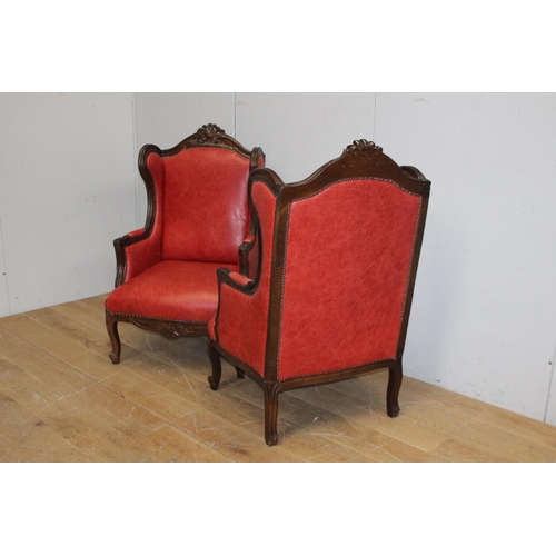 249 - Pair of leather upholstered wingbacked armchairs in the Italian style. { 124cm H X 77cm W X 54cm D }... 