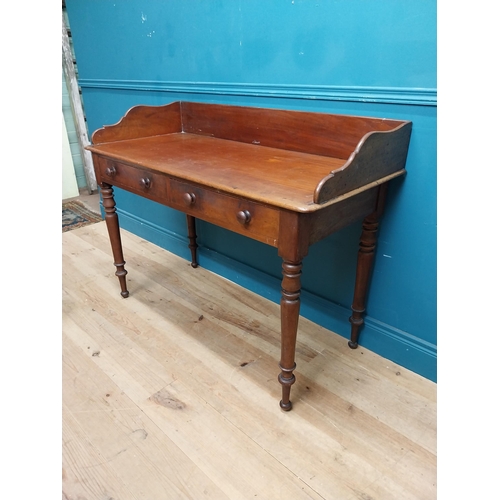 253 - 19th C. mahogany side table with gallery back and two drawers in the frieze raised on turned legs {9... 