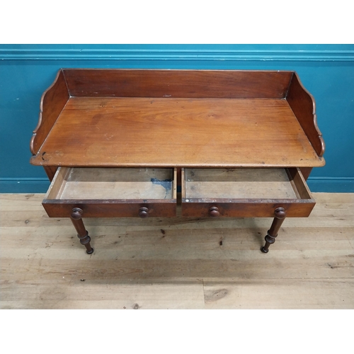 253 - 19th C. mahogany side table with gallery back and two drawers in the frieze raised on turned legs {9... 