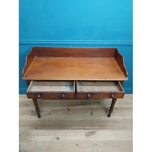 253 - 19th C. mahogany side table with gallery back and two drawers in the frieze raised on turned legs {9... 