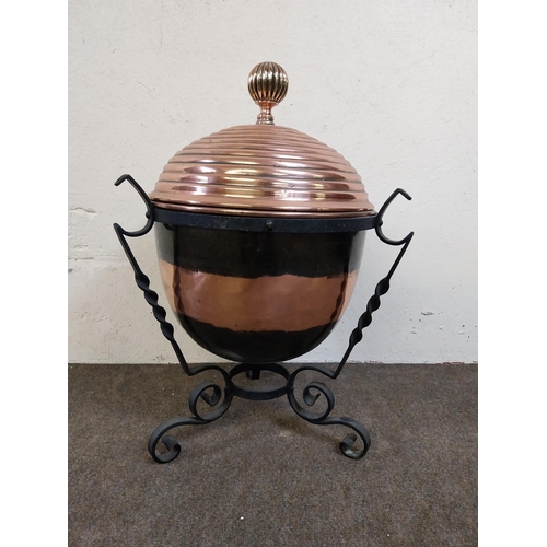 257 - 19th C. copper lidded coal bucket raised on metal stand {54 cm H x 40 cm Dia.}.