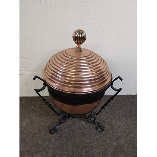 257 - 19th C. copper lidded coal bucket raised on metal stand {54 cm H x 40 cm Dia.}.