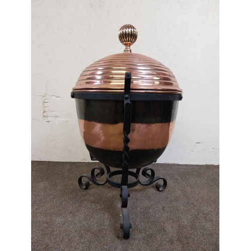 257 - 19th C. copper lidded coal bucket raised on metal stand {54 cm H x 40 cm Dia.}.