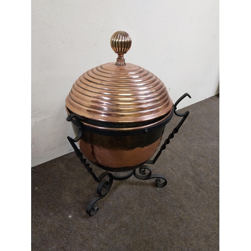 257 - 19th C. copper lidded coal bucket raised on metal stand {54 cm H x 40 cm Dia.}.