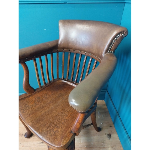 266 - 1940s oak and leather office chair raised on cabriole legs {87 cm H x 60 cm W x 60 cm D}.