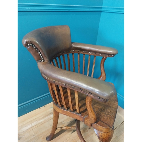 266 - 1940s oak and leather office chair raised on cabriole legs {87 cm H x 60 cm W x 60 cm D}.