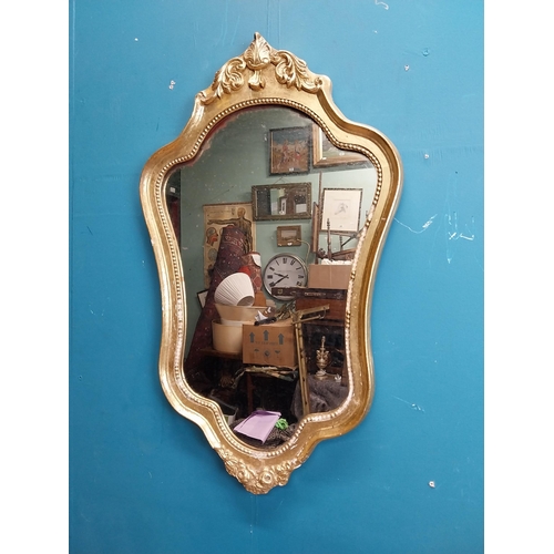 272 - French gilt and carved wall mirror in the Victorian style. {68 cm H x 40 cm W}.